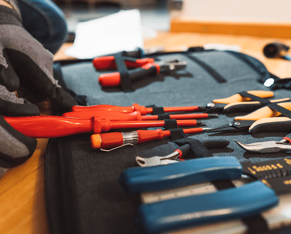Assorted tools organized in a tool case.